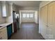 Open kitchen flowing into living area, featuring stainless steel appliances and modern finishes at 216 W Shannonhouse St, Shelby, NC 28152