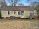 Rear exterior of home, showcasing the yard, siding and air conditioning unit at 220 Valleyview Pl, Salisbury, NC 28144