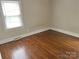 Bedroom with hardwood floors, neutral walls, and a window at 220 Valleyview Pl, Salisbury, NC 28144