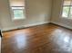 This bedroom features hardwood floors and windows that let in lots of natural light at 220 Valleyview Pl, Salisbury, NC 28144