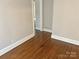 The hallway features hardwood floors, neutral paint, and white trim at 220 Valleyview Pl, Salisbury, NC 28144