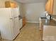 This kitchen features a refrigerator, sink, gas range and wood cabinets at 220 Valleyview Pl, Salisbury, NC 28144
