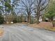 Peaceful street view featuring mature trees, lush landscaping, and well-maintained homes in a quiet neighborhood at 220 Valleyview Pl, Salisbury, NC 28144