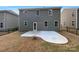 Spacious backyard featuring a concrete patio, grassy area, and privacy fence at 2236 Sussex Rd, York, SC 29745
