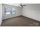 Bedroom features a ceiling fan, two windows, and neutral carpeting at 2236 Sussex Rd, York, SC 29745