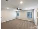 Primary bedroom featuring two windows with blinds, ceiling fan, and carpet at 2236 Sussex Rd, York, SC 29745