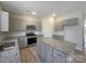 Well-lit kitchen features granite countertops, stainless steel appliances, and a center island at 2236 Sussex Rd, York, SC 29745
