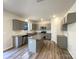 Modern kitchen featuring granite counters, an island, stainless steel appliances and ample cabinet space at 2236 Sussex Rd, York, SC 29745