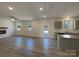 Open concept living room features a fireplace, durable floors, and lots of natural light at 2236 Sussex Rd, York, SC 29745