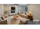 Bright living room with fireplace, plush seating, hardwood floors and ample natural light at 2236 Sussex Rd, York, SC 29745