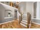 Grand foyer boasts high ceilings, staircase, and gleaming hardwood floors at 2300 Bonnie Butler Way, Charlotte, NC 28270