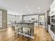 Bright kitchen with a center island, stainless steel appliances, and hardwood floors at 2300 Bonnie Butler Way, Charlotte, NC 28270