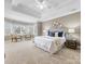 The spacious main bedroom offers bay windows, a ceiling fan, and an ensuite bathroom at 2300 Bonnie Butler Way, Charlotte, NC 28270