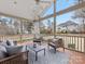 Covered back porch featuring comfortable seating with a ceiling fan to keep cool at 2300 Bonnie Butler Way, Charlotte, NC 28270