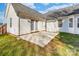 Concrete patio featuring white siding and a grassy lawn with a view of the expansive backyard and privacy fence at 2359 Eagle Glen Ct, Gastonia, NC 28056