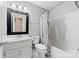 Clean bathroom features a vanity, mirror, toilet and tub/shower combination at 2359 Eagle Glen Ct, Gastonia, NC 28056