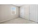 Bright bedroom features a window, neutral carpet and fresh, neutral paint at 2359 Eagle Glen Ct, Gastonia, NC 28056