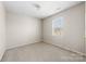 Neutral bedroom features a light, neutral carpet, window and fresh, neutral paint at 2359 Eagle Glen Ct, Gastonia, NC 28056