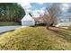 Charming home featuring an attached two-car garage, white siding, and a well-maintained front yard with lush greenery at 2359 Eagle Glen Ct, Gastonia, NC 28056