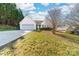 Charming home featuring an attached two-car garage, white siding, and a well-maintained front yard with lush greenery at 2359 Eagle Glen Ct, Gastonia, NC 28056