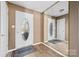 Welcoming front foyer with a decorative front door, wood flooring, and a full-length mirror at 2359 Eagle Glen Ct, Gastonia, NC 28056