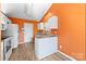 Efficient kitchen layout with granite countertops, white cabinetry, and modern appliances at 2359 Eagle Glen Ct, Gastonia, NC 28056
