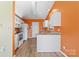 Efficient kitchen layout with granite countertops, white cabinetry, and modern appliances at 2359 Eagle Glen Ct, Gastonia, NC 28056