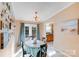 Bright dining area featuring French doors to the outdoor deck and convenient access to the kitchen at 24654 Helms Rd, Albemarle, NC 28001