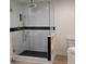 Bathroom features an all-glass shower with black and gold hardware at 2545 Stockbridge Dr, Charlotte, NC 28210