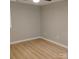 Cozy, empty bedroom with new flooring and window at 2545 Stockbridge Dr, Charlotte, NC 28210