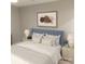 Inviting bedroom with a plush blue headboard, decorative pillows, and stylish nightstands at 2545 Stockbridge Dr, Charlotte, NC 28210