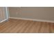 Neutral bedroom with wood-look flooring and white baseboards at 2545 Stockbridge Dr, Charlotte, NC 28210