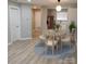 Charming dining area featuring a round table with four chairs and a modern pendant light fixture at 2545 Stockbridge Dr, Charlotte, NC 28210