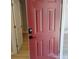 Eye-catching red front door with modern digital keypad entry and sidelight at 2545 Stockbridge Dr, Charlotte, NC 28210