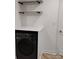 The laundry room features shelving and modern appliances at 2545 Stockbridge Dr, Charlotte, NC 28210
