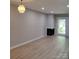 Open living room with fireplace and sliding glass doors at 2545 Stockbridge Dr, Charlotte, NC 28210