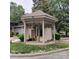 Community mailboxes are housed in a gazebo near lush landscaping at 2545 Stockbridge Dr, Charlotte, NC 28210