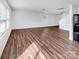 A bright open-concept living room features wood-look flooring and multiple windows at 2609 Riley Woods Ln, Charlotte, NC 28269