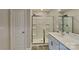 Bathroom featuring a shower with glass doors, modern vanity, and contemporary fixtures at 299 Berrybeth Cir, China Grove, NC 28023