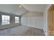 Inviting bedroom featuring vaulted ceilings and large window at 299 Berrybeth Cir, China Grove, NC 28023