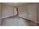 Bedroom featuring neutral walls and carpeting with two doors, one leading to the hallway at 299 Berrybeth Cir, China Grove, NC 28023