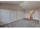 Cozy bedroom with a panel wall, carpeting and ensuite bathroom at 299 Berrybeth Cir, China Grove, NC 28023