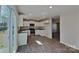 Modern kitchen featuring white cabinets, granite countertops, and stainless steel appliances at 299 Berrybeth Cir, China Grove, NC 28023
