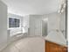 Bathroom featuring a soaking tub and a vanity with sink and traditional fixtures at 331 Don Mccarter Dr, Clover, SC 29710