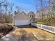 Charming home boasts a two-car garage, classic siding, and a welcoming front porch for relaxing and entertaining at 331 Don Mccarter Dr, Clover, SC 29710