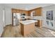 Eat-in kitchen with stainless steel appliances, kitchen island, and wooden cabinets at 331 Don Mccarter Dr, Clover, SC 29710