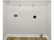 A simple laundry room with a wire shelf, wooden trim, and washer and dryer hookups at 331 Don Mccarter Dr, Clover, SC 29710