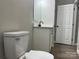 Bathroom features a toilet and vanity with speckled countertops, showcasing a modern, clean design at 3342 York Hwy, Gastonia, NC 28052