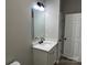 Bathroom highlighting a modern vanity with mirror and lighting with a white door nearby at 3342 York Hwy, Gastonia, NC 28052