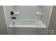 Bathroom highlighting a bright white tub and shower combination with black fixtures at 3342 York Hwy, Gastonia, NC 28052